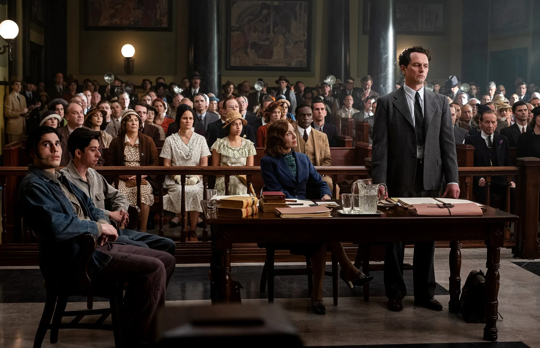PM_203_040522_MM_8496_f A group of people sitting in a courtroom.